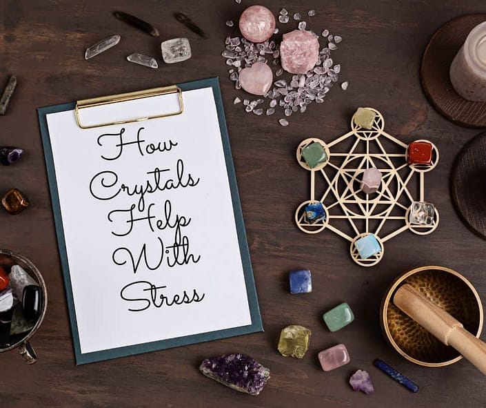 Healing crystals with a notebook that says what crystals help with stress