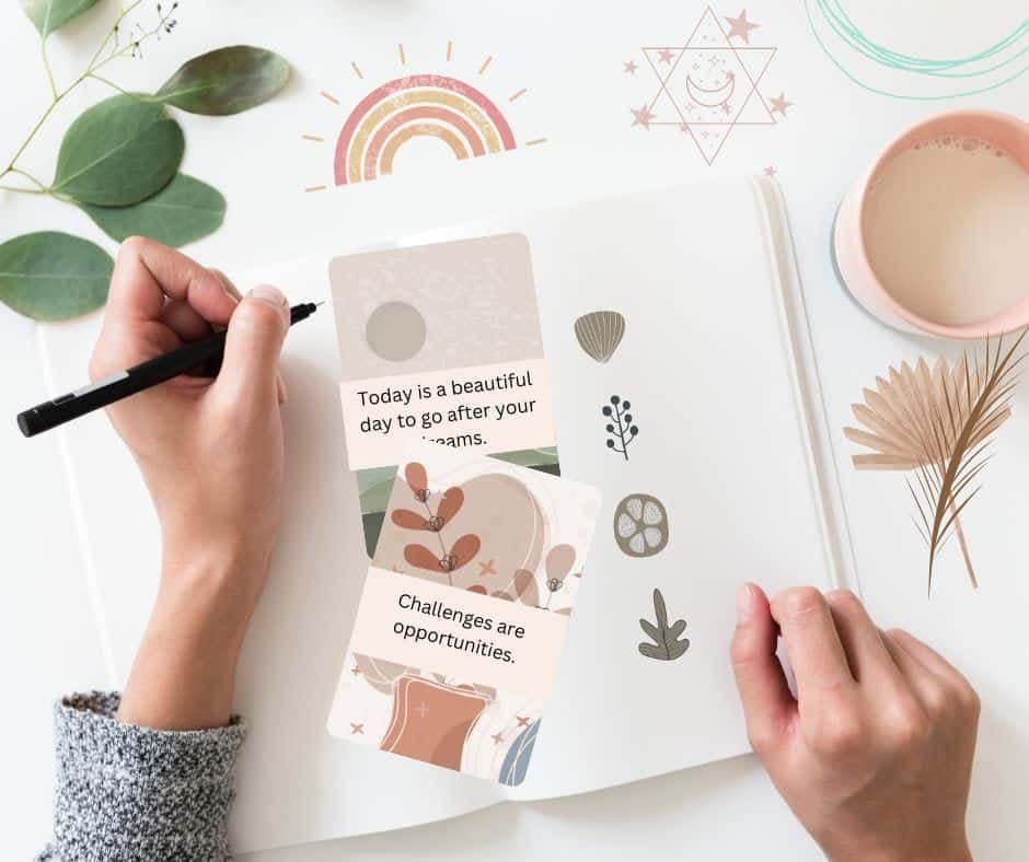 Writing in a manifestation journal with positive affirmation cards